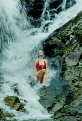 Lora enjoying a cool waterfall on Lantau Island