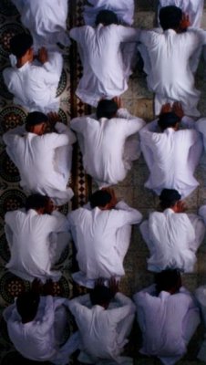 Cao Dai worshippers prostrate themselves